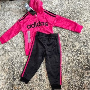Pink and black adidas track suit